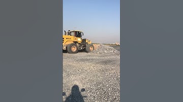 The Stronger Matadors Wheel loader Pushing rock to backfill on construction.
