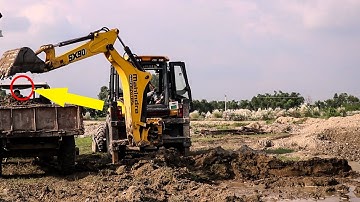 Mahindra Earthmaster  Backhoe Loader SX90 loading Mud On Sonalika Tractor  -Mahindra Machine