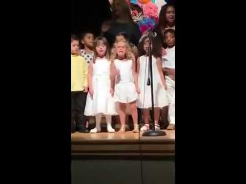 Little girl owns stage at preschool graduation