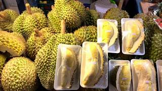 Cutting a whole Durian