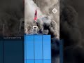 Skyscraper engulfed in flames and plumes of smoke in Reading