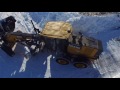 John Deere Grader using one way plow and wing clearing snow