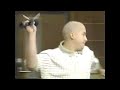 Brother of murder victim throws microphone at defendant