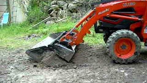 Four-in-one bucket operation on Kioti CK30 tractor