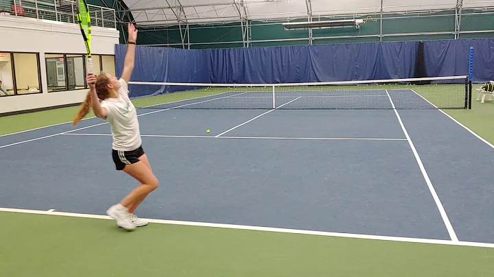 Emily Beckner serves behind view