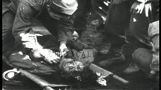 Medics of 442nd Regiment (Japanese-American) treat wounded in Belmont, France dur...HD Stock Footage