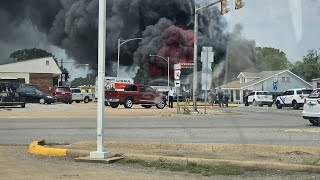 Road reopens after firefighters battle heat, massive tire shop fire