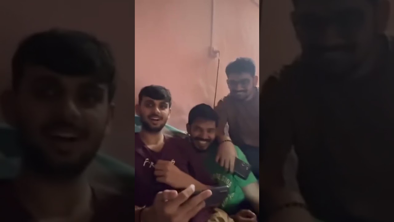 Men Relax and Scroll on Phones in Cozy Pink B