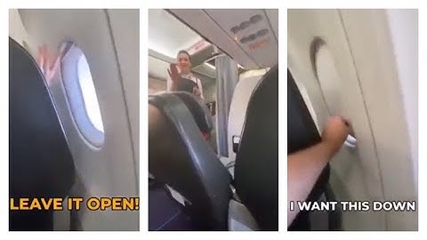 Window Shade Wars : A man shuts the window shade of the person infront of him.