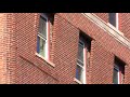Bricks bow outward on historic Hotel Lorraine in downtown Toledo; roadway shut down