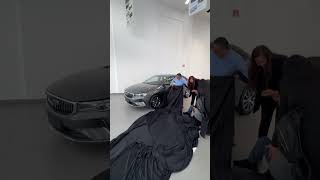 Excited Man Falls Backward During New Car Reveal