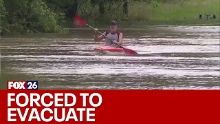 Humble residents forced to leave homes due to flooding, some stay