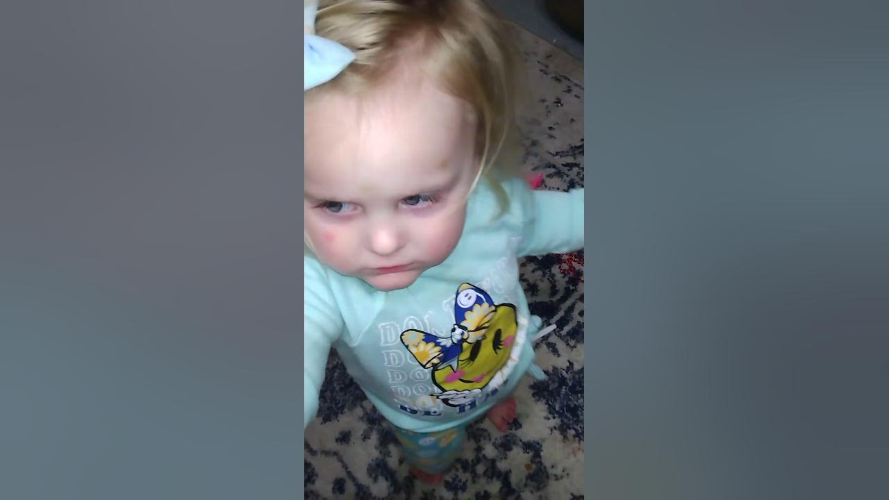 baby-makes-a-cute-squealing-noise-when-playing-with-toy-dinosaur