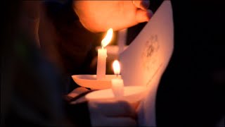 Community holds candlelight vigil for two of their own