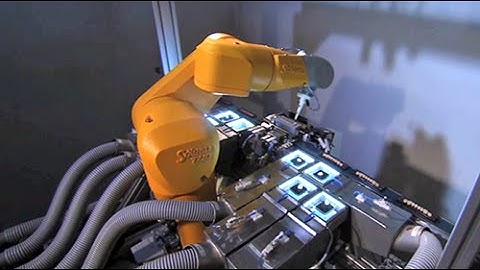 Packaging of denture teeth with a compact Stäubli TX40 6-axis robot