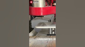 5+2 axis bridge saw uses a milling cutter and a shaping wheel to machine a stone dining table