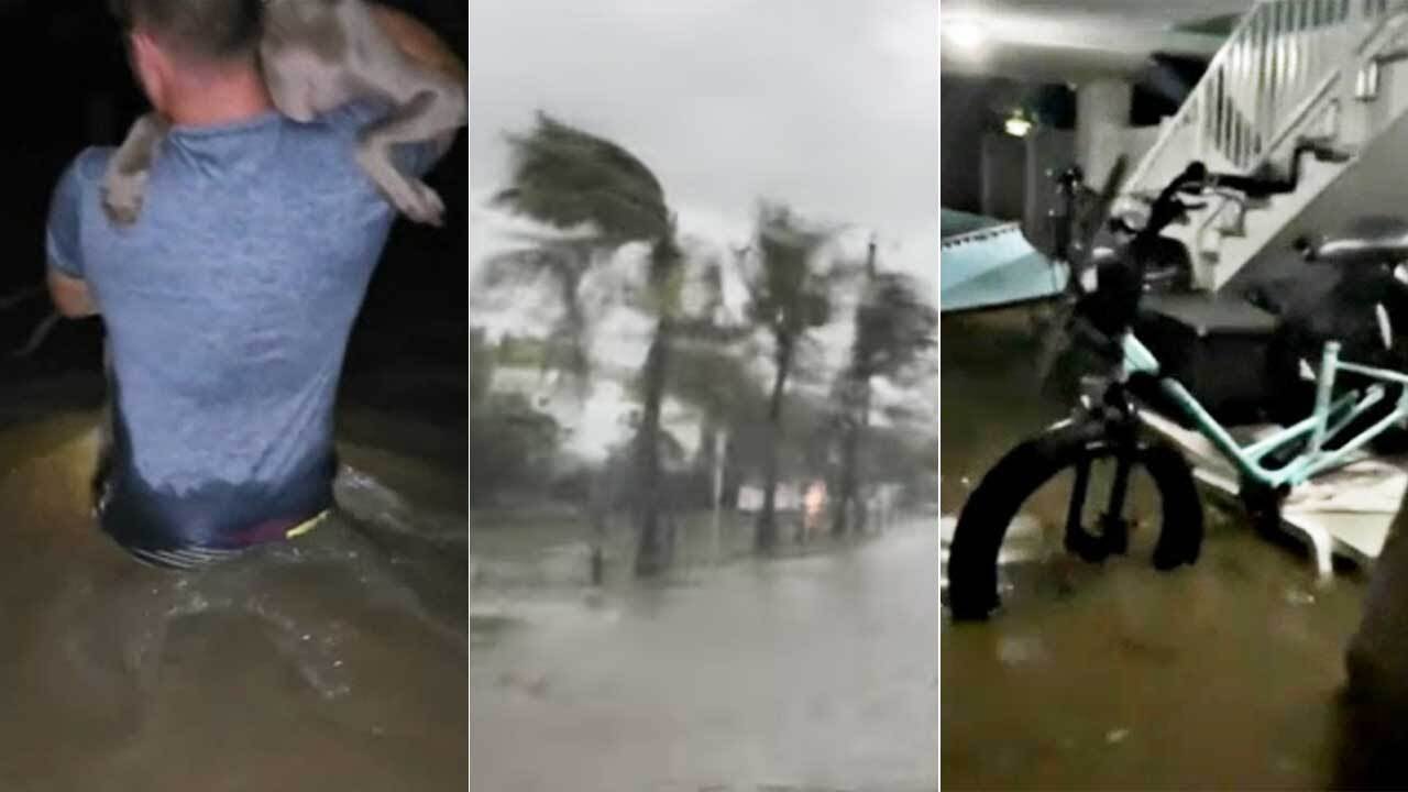 Footage from Hurricane Ian shows residents evacuating in waist-deep water