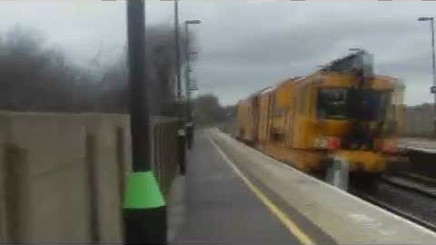 (HD) A Network Rail Tamper Passes Tamworth High Level