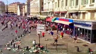 Football Fans Fight in the street (throwing bottles)