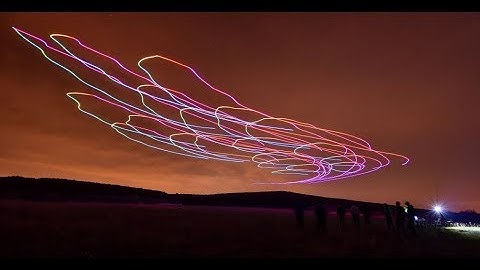 Optimized flocking of autonomous drones in confined environments