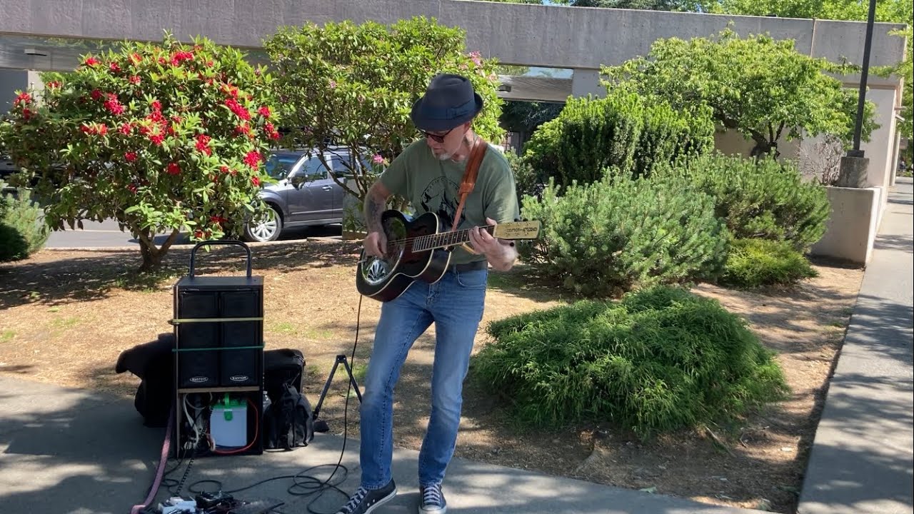 Jeff Markowicz, playing a resonator guitar w/ a looperdrum machine
