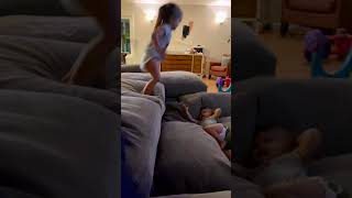 Girl jumps off couch and lands on baby sisters head