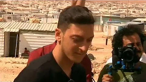Soccer star Mesut Ozil has kickabout with young Syrian refugees
