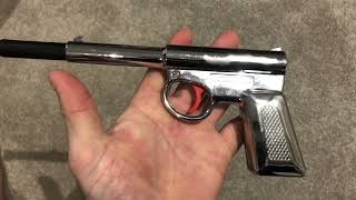 T J Harrington "Red Trigger" Chrome Gat Gun Pop Out Air Gun Pistol.