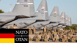 NATO. German paratroopers jump from USAF C-130 Hercules aircraft.