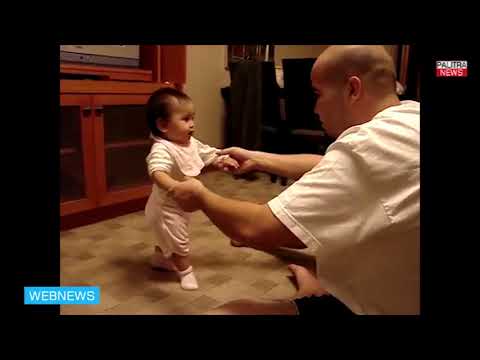 გოგონა პირველი ნაბიჯების გადადგმას ცდილობს