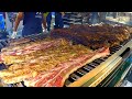 Italy Street Food Event. Huge Blocks of Meat on Grill, Asado, Super Loaded Sandwiches and more Food