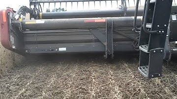 MacDon draper head up close while in operation