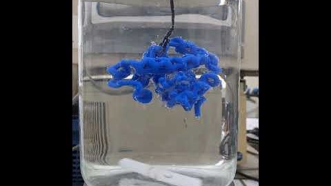 Soluble support dissolving away from the 3D printed model of hemoglobin