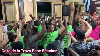 Septeto Santiaguero en la Casa de la Trova de Santiago de Cuba.  Sandunga dancing with its clients.