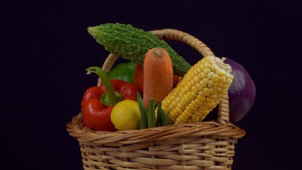 A beautiful basket of fresh vegetables against the black backg... | Indian Stock Footage | Knot9
