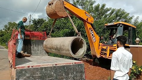 Jcb Backhoe Hume Pipe Unloading | Jcb Cement Pipe Lifting And Placing