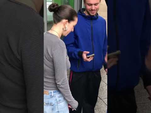 Girl Enjoying a Cigarette while Chatting with Friends