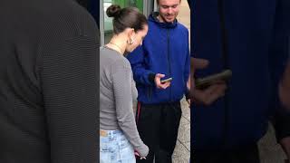 Girl Enjoying a Cigarette while Chatting with Friends