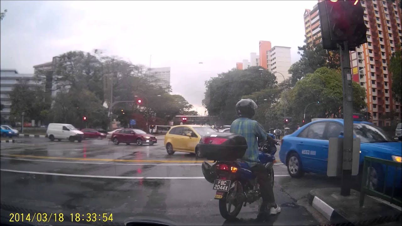 Motorcyclist made U turn when traffic light is still red