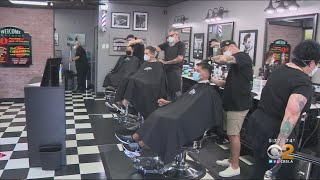 The chairs at barberhood in laguna hills were high demand friday, its
first day back open since coronavirus pandemic began.