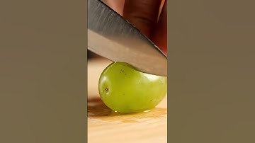 Ultra close-up ASMR of a sharp knife slowly slicing into a fresh, textured (GRAPES)capture #shorts