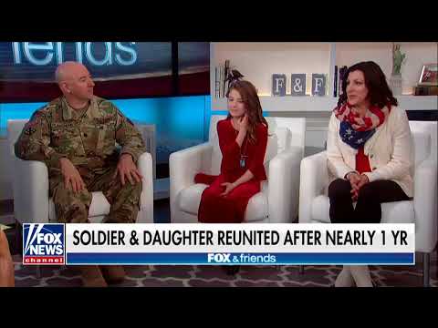 Dad returns from deployment to surprise daughter at school.