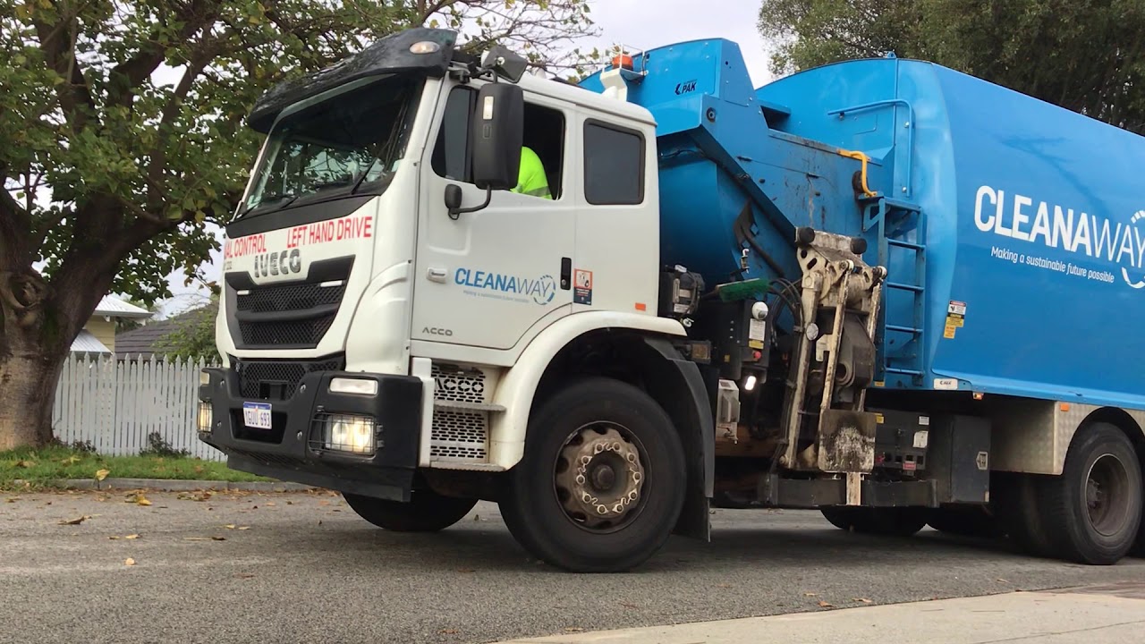 yellow garbage truck