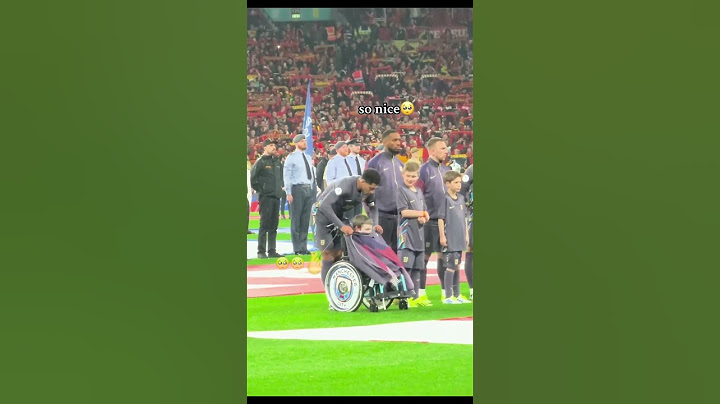 Jude Bellingham gives his jacket to a cold little boy while rain fell