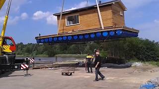 :    . Floating sauna/house on barrels.