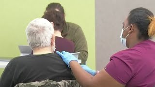 CDC director defends decision to make frontline workers eligible for booster dose of COVID vaccine