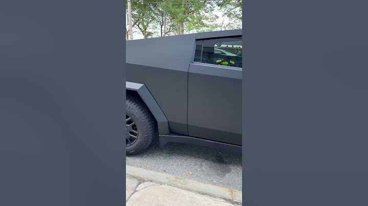 Tesla Cybertruck matte black EV electric pickup truck in the wild 2024