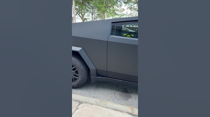 Tesla Cybertruck matte black EV electric pickup truck in the wild 2024