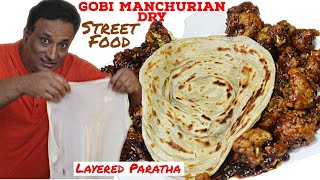 Gobi Manchurian Dry Served with Lacha Paratha Street Food - Cauliflower Manchurian Gravy