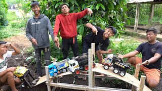 TRUK MINIATUR MUATAN BATU MELEWATI JEMBARAN CUR4M